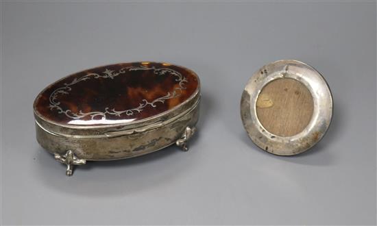 A George V silver and tortoiseshell trinket box and a small photo frame.